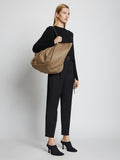 Image of model carrying XL Ruched Tote in LIGHT TAUPE on shoulder