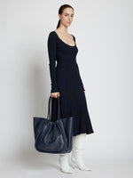 Image of model carrying XL Ruched Tote in DARK NAVY
