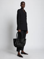 Image of model holding Large Ruched Tote in BLACK