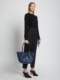 Image of model holding Large Ruched Tote in DARK NAVY