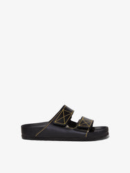 Proenza Schouler side image of Birkenstock collaboration Arizona Slides in black with yellow contrast stitching