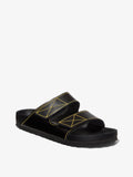 Proenza Schouler front 3/4 image of Birkenstock collaboration Arizona Slides in black with yellow contrast stitching