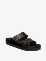 Proenza Schouler front 3/4 image of Birkenstock collaboration Arizona Slides in black with yellow contrast stitching