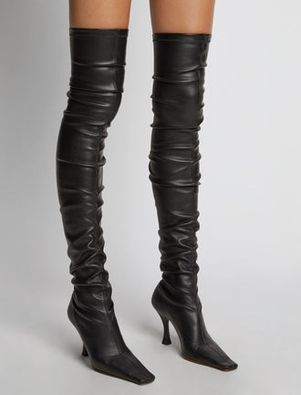 Proenza Schouler Image of model wearing Trap Over the Knee Boots in Black