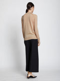 Back full length image of model wearing Eco Superfine Merino Sweater in BEIGE