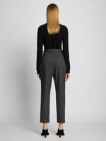 Back full length image of model wearing Upcycled Wool Carrot Pants in CHARCOAL