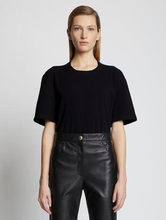 Front cropped image of model wearing Eco Cotton T-Shirt in BLACK