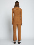 Back full length image of model wearing Fine Gauge Rib Knit Top in CHESTNUT/BLACK