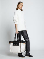 Image of model carrying XL Morris Coated Canvas Tote in OFF WHITE