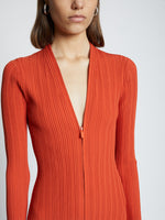 Detail image of model wearing Rib Knit Zip Cardigan Dress in BRIGHT ORANGE