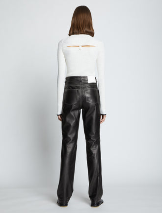 Back full length image of model wearing Leather Straight Pants in BLACK