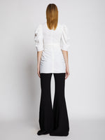 Back full length image of model wearing Linen Viscose Shirred Sleeve Top in OFF WHITE