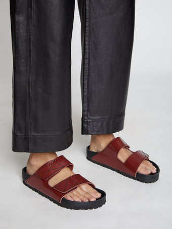 Image of model wearing Birkenstock X Proenza Schouler Arizona Slides in Luggage