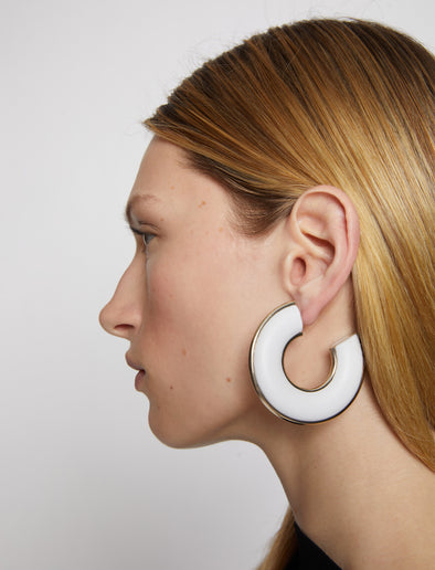 Image of model wearing LEATHER HOOP EARRINGS - OPTIC WHITE