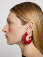 Image of model wearing LEATHER HOOP EARRINGS - FLAME RED