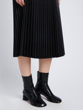 Detail image of model in Faux Leather Pleated Skirt in black