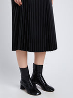 Detail image of model in Faux Leather Pleated Skirt in black