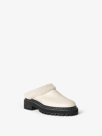 Front 3/4 image of Shearling Lug Sole Mules in WHITE