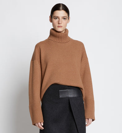 Front cropped image of model wearing Doubleface Eco Cashmere Oversized Turtleneck Sweater in SADDLE