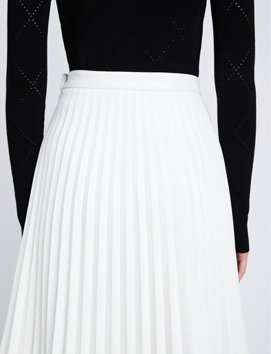 Detail image of model in Faux Leather Pleated Skirt in white