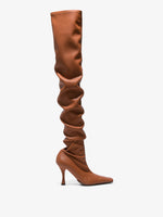 Side image of thigh-length stiletto boots in Tan