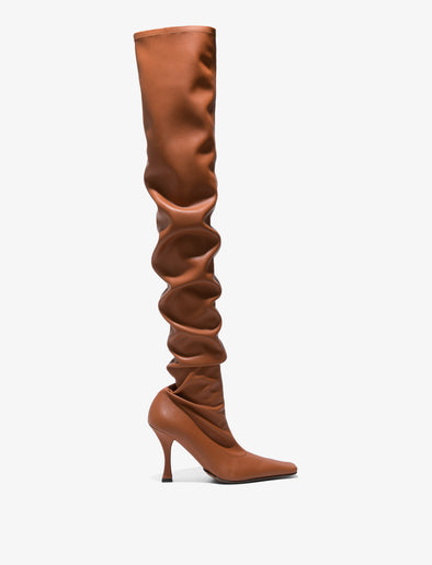 Side image of thigh-length stiletto boots in Tan