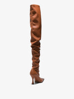 Back 3/4 image of thigh-length stiletto boots in Tan
