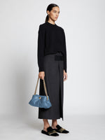 Image of model wearing Small Puffy Chain Bag in DUSTY BLUE