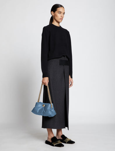 Image of model wearing Small Puffy Chain Bag in DUSTY BLUE