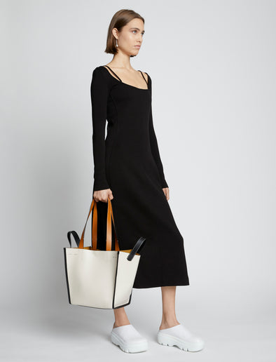 Image of model carrying Large Mercer Leather Tote in VANILLA in hand