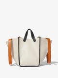Image of model carrying Large Mercer Leather Tote in VANILLA on shoulder