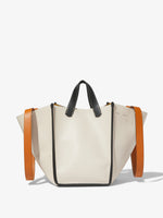 Image of model carrying Large Mercer Leather Tote in VANILLA on shoulder