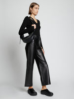 Image of model wearing Stanton Leather Sling Bag in BLACK