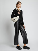 Image of model wearing Stanton Leather Sling Bag in vanilla