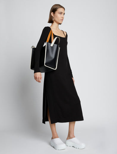 Image of model carrying Large Mercer Leather Tote in BLACK in hand
