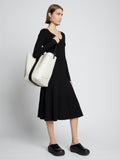 Image of model carrying Sullivan Leather Bag in VANILLA on shoulder
