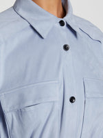 Detail image of model wearing Faux Suede Shirt in STONE BLUE