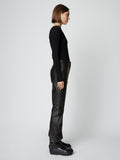 Side full length image of model wearing Leather Straight Pant in BLACK