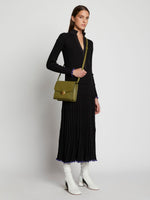 Image of model carrying Dia Day Bag in moss