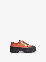 Side image of City Lug Sole Shoes in dark orange