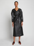 Front full length image of model wearing Faux Leather Wrap Dress in BLACK