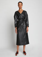 Front full length image of model wearing Faux Leather Wrap Dress in BLACK