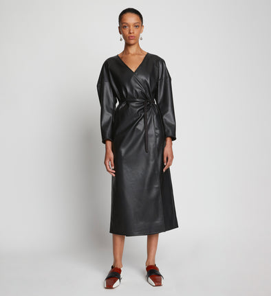Front full length image of model wearing Faux Leather Wrap Dress in BLACK