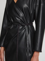 Detail image of model wearing Faux Leather Wrap Dress in BLACK