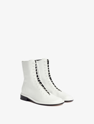 3/4 Front image of Pipe Lace Up Boots in White.jpg