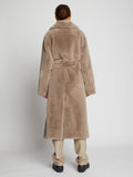 Side full length image of model wearing Faux Fur Belted Coat in TAUPE