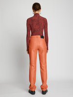 Back full length image of model wearing Leather Straight Pants in TERRACOTTA