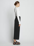 Side full length image of model wearing Crepe Wide Leg Pants in BLACK