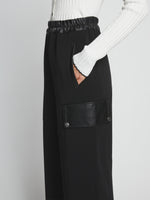 Detail image of model wearing Crepe Wide Leg Pants in BLACK