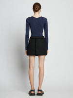 Back full length image of model wearing Melange Rib V-Neck Top in BLUE/BLACK